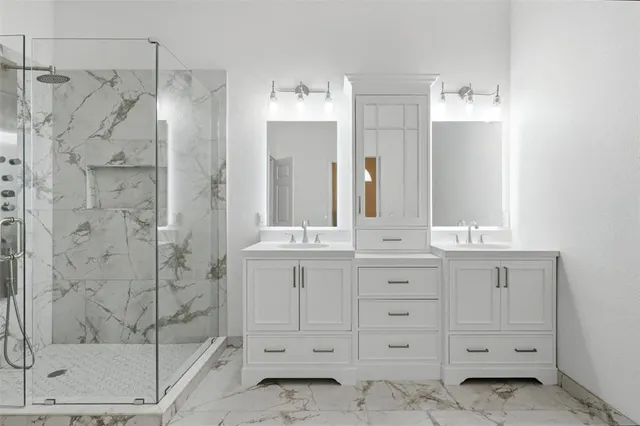 a bathroom with a shower sink and mirror