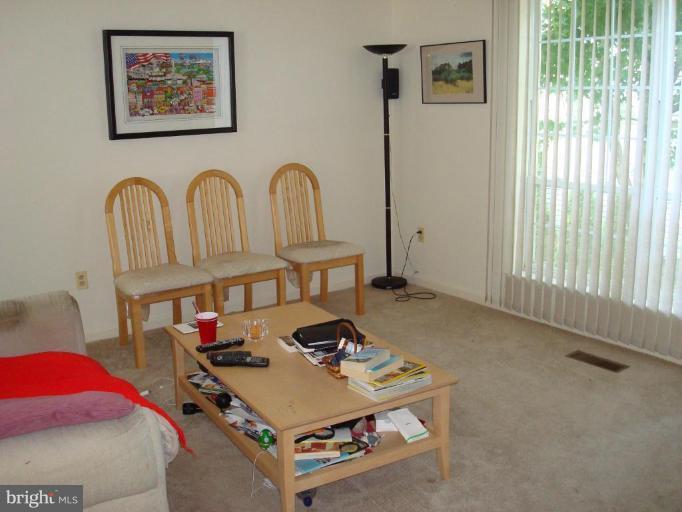 6149 Good Hunters Ride Columbia, MD 21045 - Photo 2 of 30 a living room with furniture and next to a window