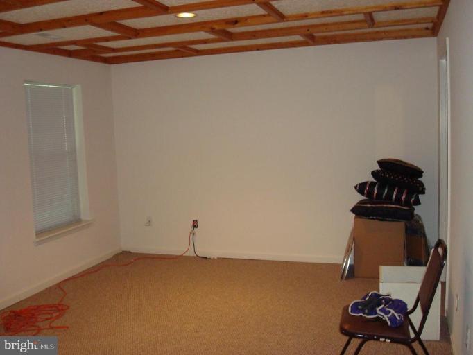6149 Good Hunters Ride Columbia, MD 21045 - Photo 22 of 30 a view of a room with rack and wooden floor