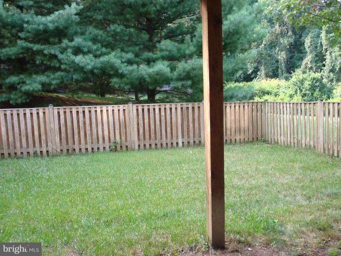 6149 Good Hunters Ride Columbia, MD 21045 - Photo 27 of 30 a view of a yard with a wooden fence