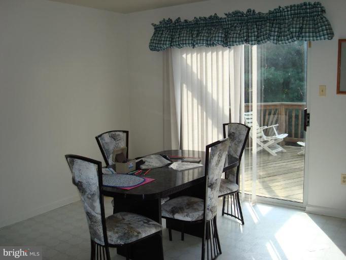 6149 Good Hunters Ride Columbia, MD 21045 - Photo 10 of 30 a dining room with furniture and window