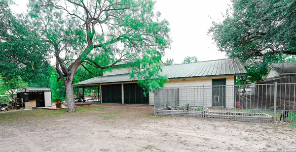 a front view of a house with a yard and a garage
