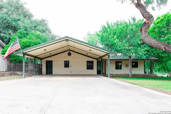 a front view of a house with a garage