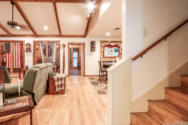 a view of entryway with wooden floor and stairs