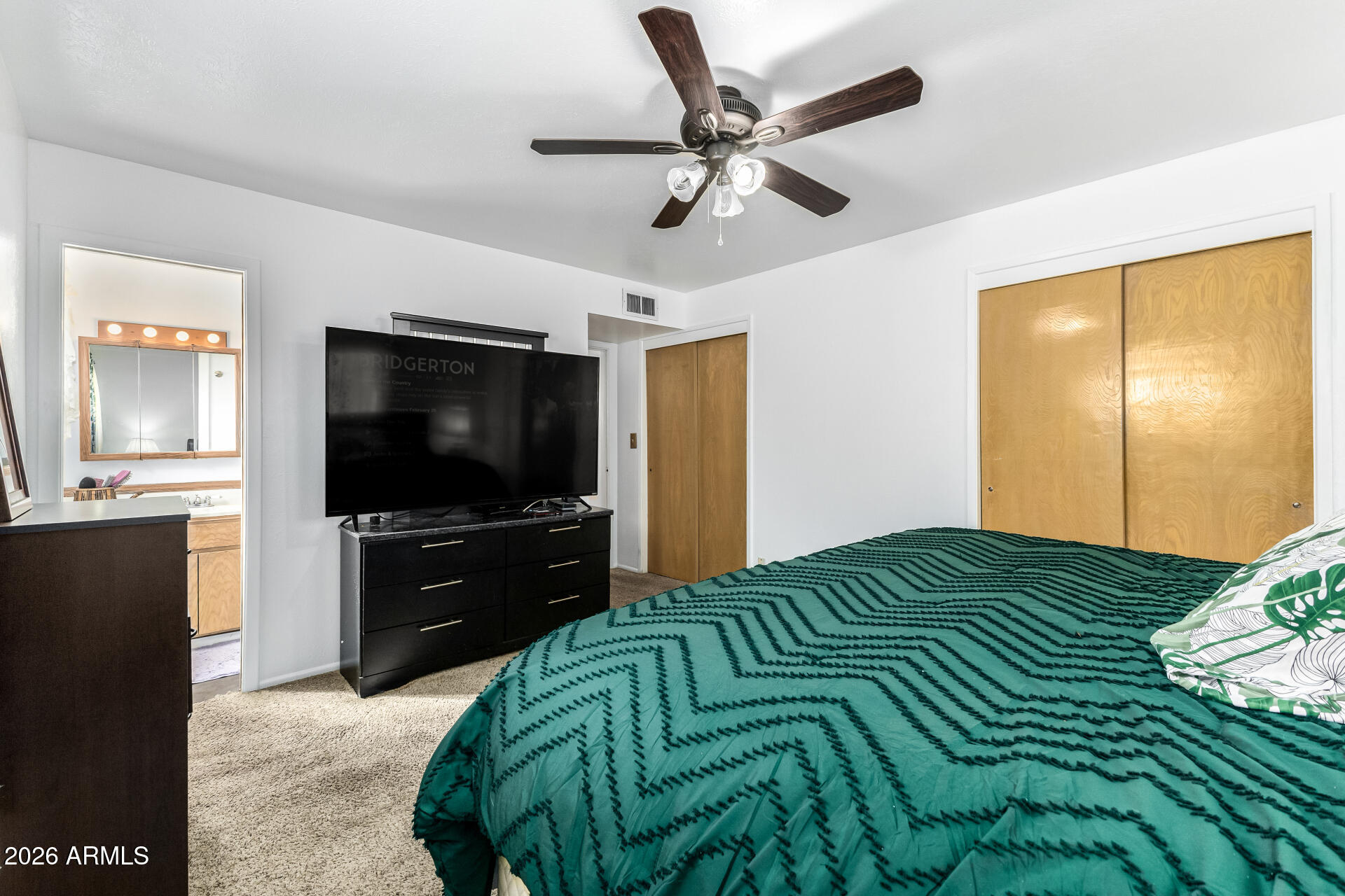 5519 Casper Road Mesa, AZ 85205 - Photo 13 of 23 a bedroom with a bed and a flat screen tv