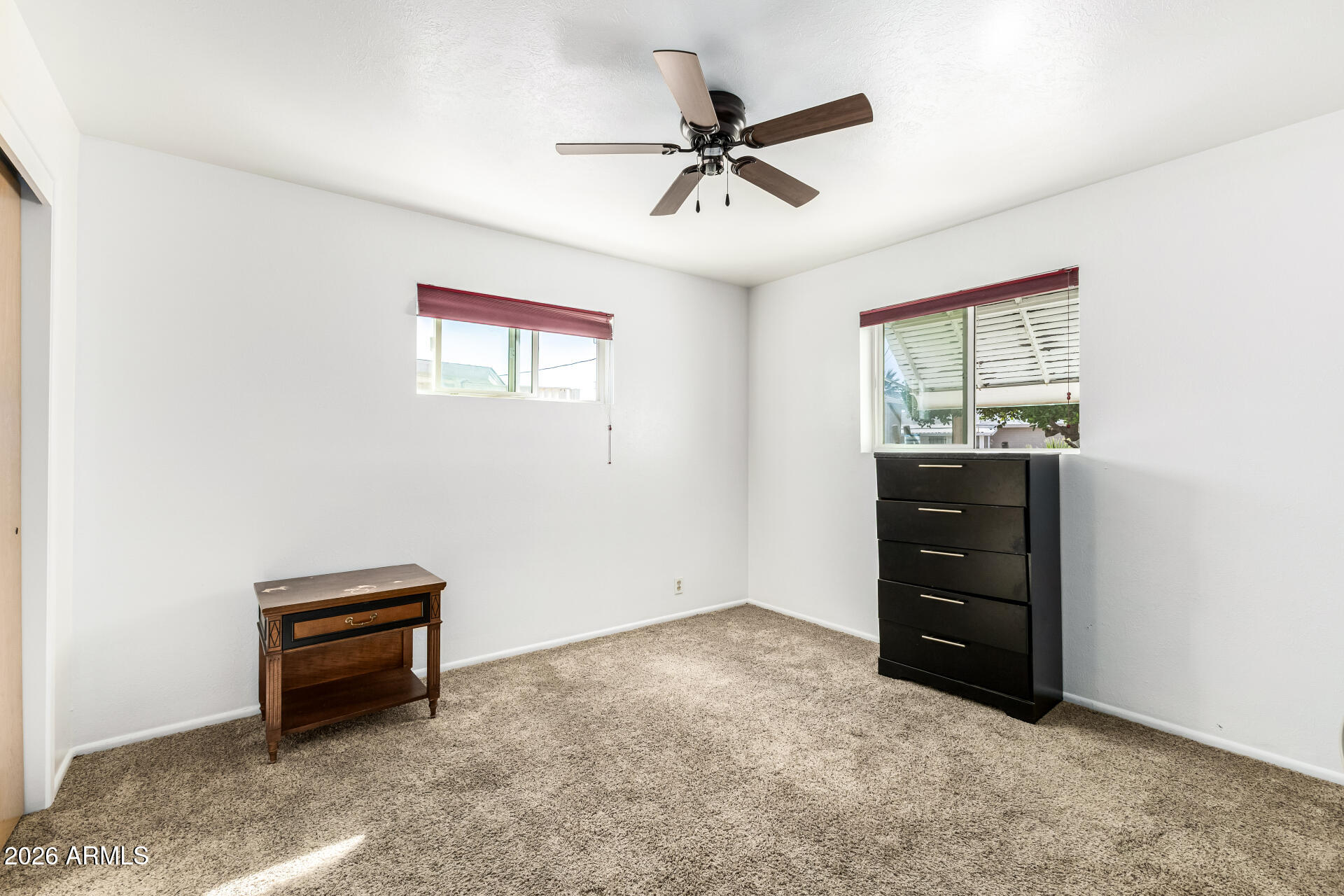 5519 Casper Road Mesa, AZ 85205 - Photo 15 of 23 a room with a dresser and a window