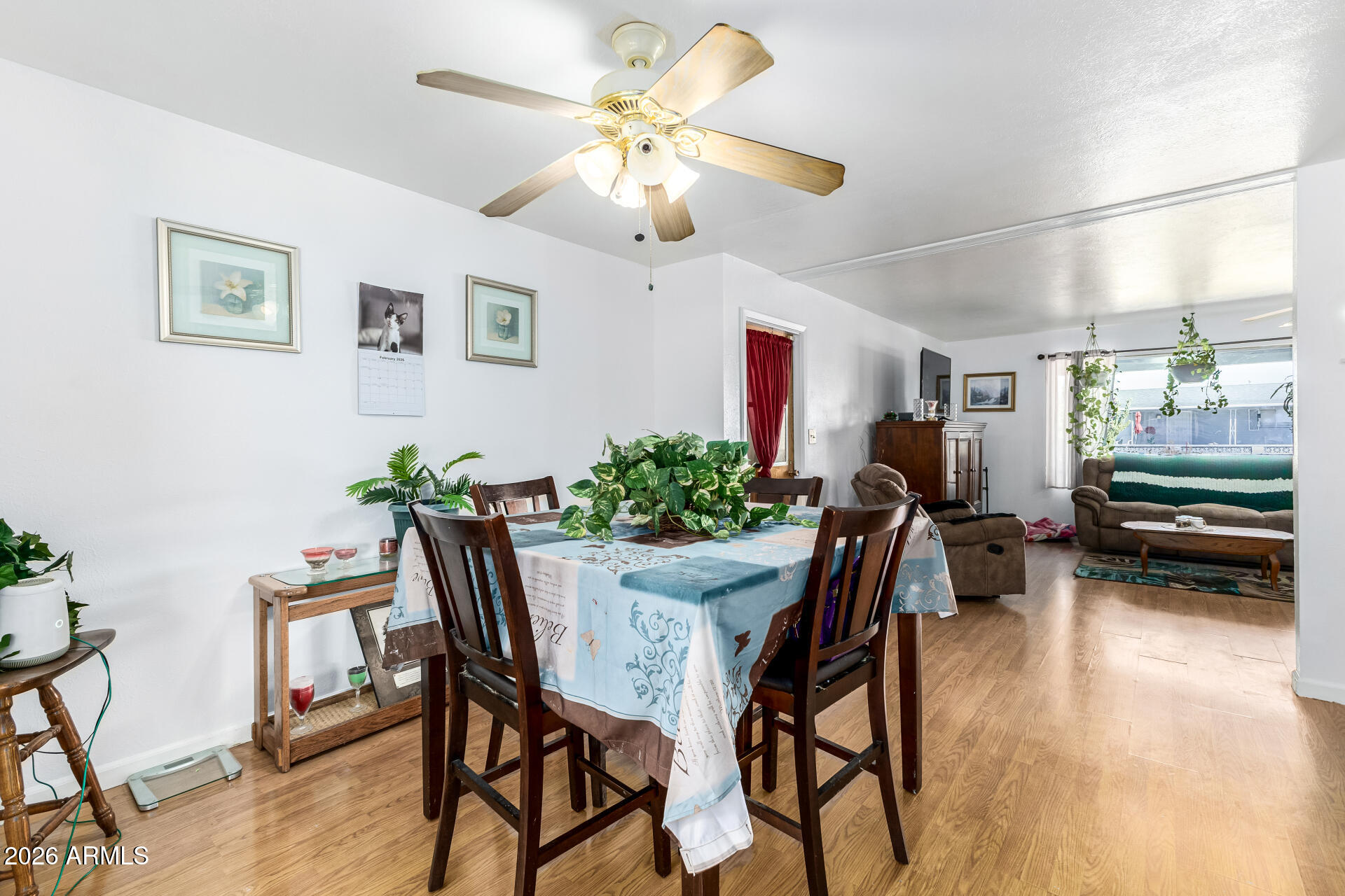 5519 Casper Road Mesa, AZ 85205 - Photo 7 of 23 a view of a dining room with furniture and a chandelier