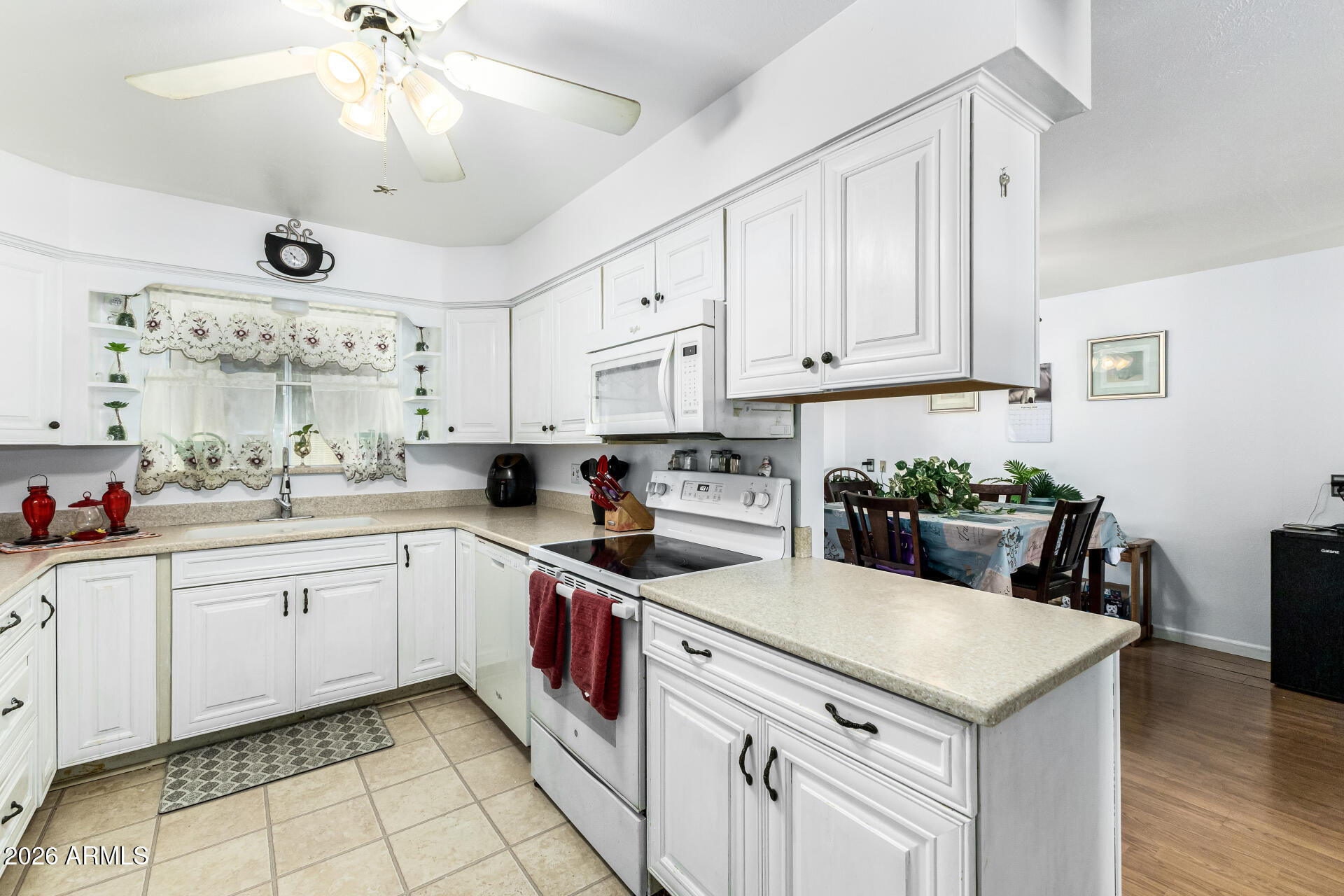 5519 Casper Road Mesa, AZ 85205 - Photo 9 of 23 a kitchen with cabinets appliances and a counter top space