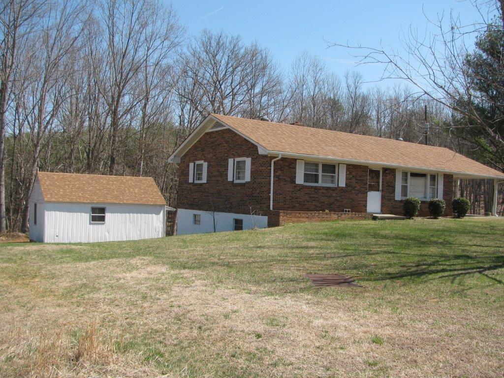 4348 Old Mine Road Gretna, VA 24557 - Photo 26 of 29 a front view of a house with a garden