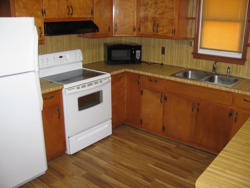 4348 Old Mine Road Gretna, VA 24557 - Photo 6 of 29 a kitchen with a stove and a microwave