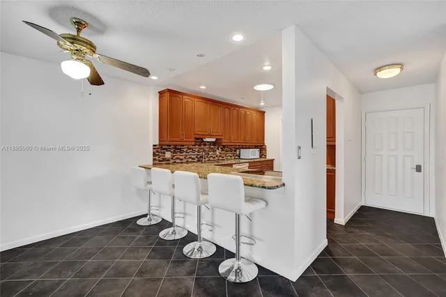 a kitchen with a sink cabinets and appliances