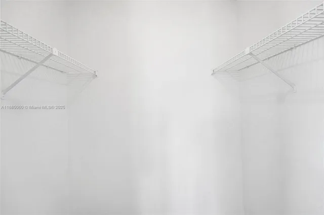 a picture of a bathroom with a shower
