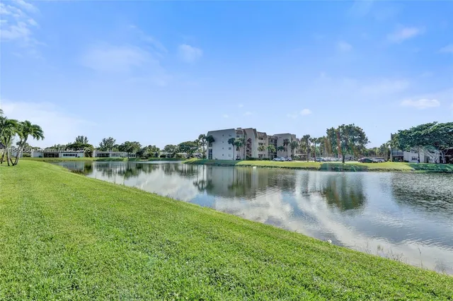 a view of a lake with houses in the background