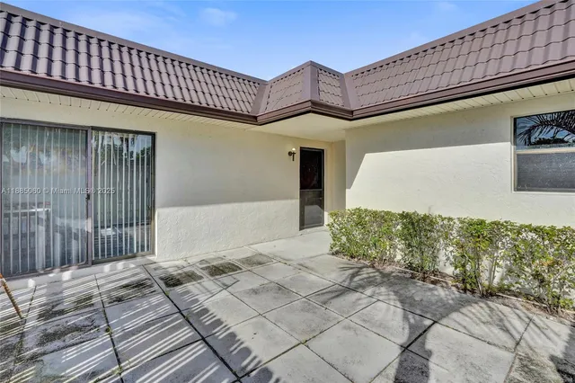 a bedroom with a bed and a book shelf