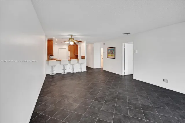 a view of a livingroom with furniture and an entryway