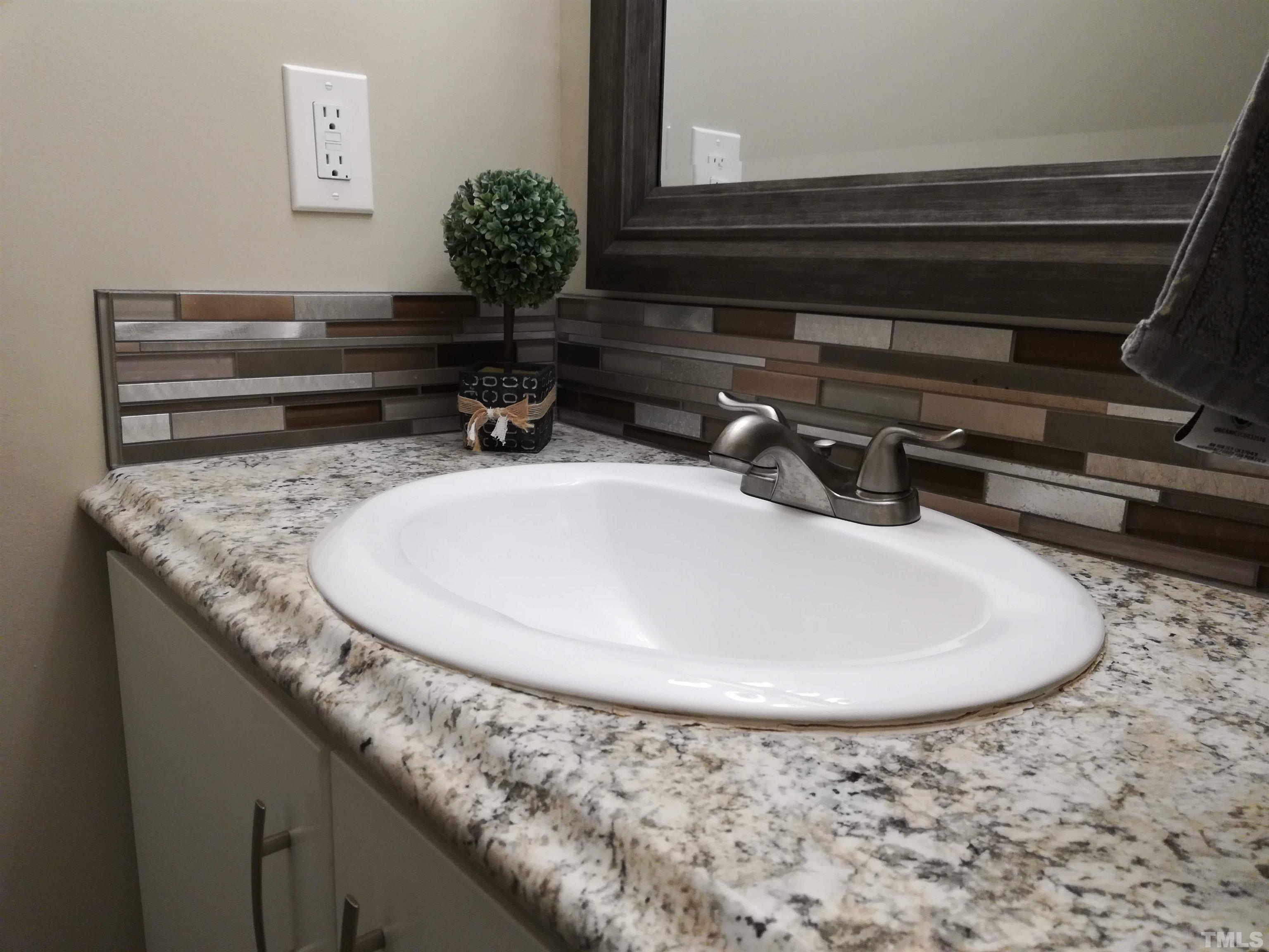3 Prestwick Place Durham, NC 27705 - Photo 12 of 21 a bathroom with a granite countertop sink and a mirror