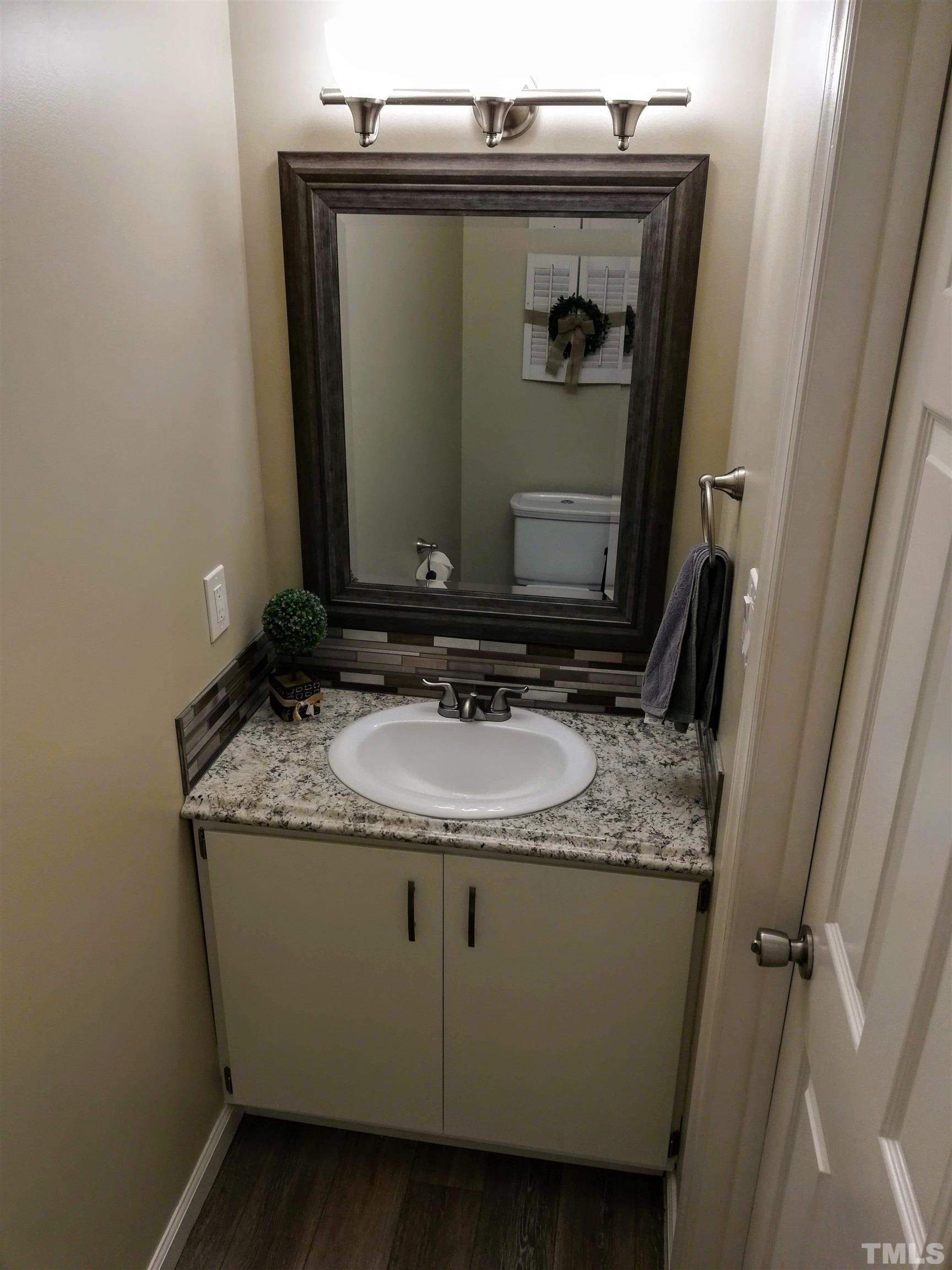 3 Prestwick Place Durham, NC 27705 - Photo 14 of 21 a bathroom with a granite countertop sink and a mirror