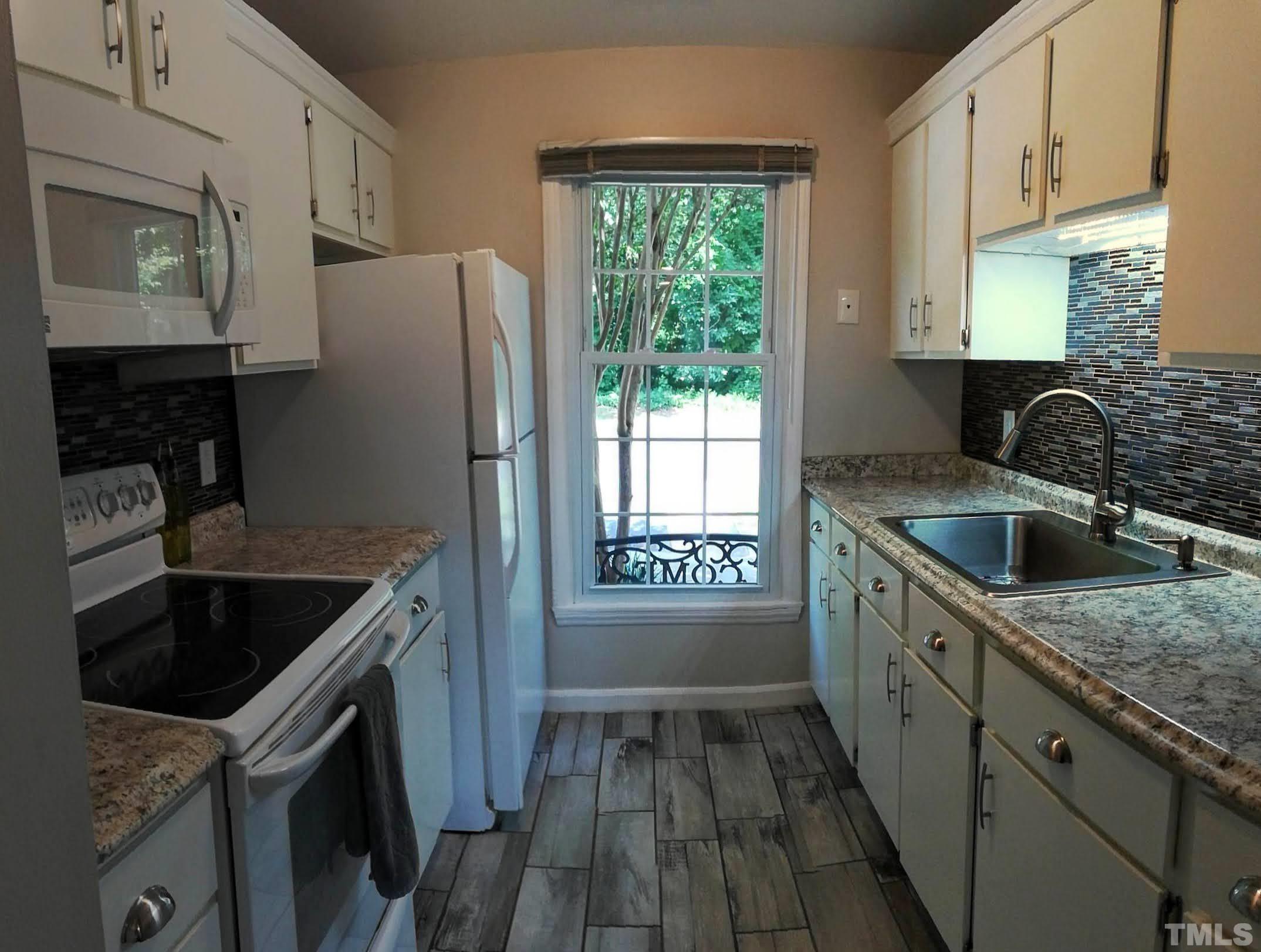 3 Prestwick Place Durham, NC 27705 - Photo 21 of 21 a kitchen that has a sink a stove and window