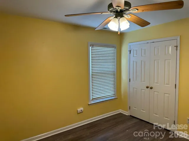 a view of room with window and fan