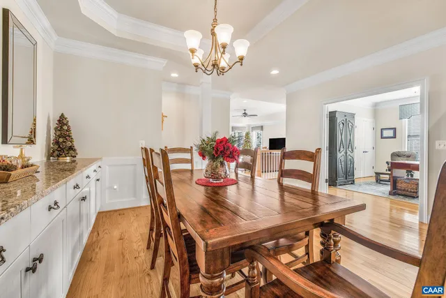 a spacious bedroom with a bed and a chandelier