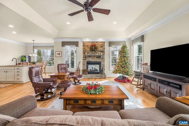 a bathroom with a granite countertop sink toilet a mirror and shower
