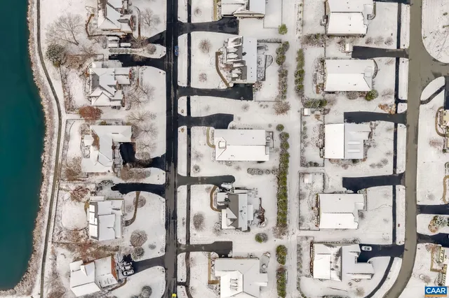 a bedroom with a bed and a mirror