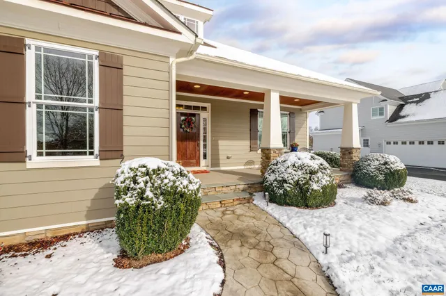 a reading room with furniture and a book shelf