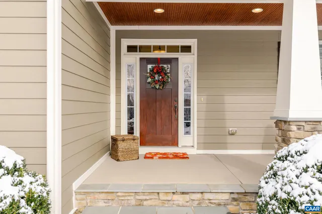 a view of a workspace with furniture and a bookshelf