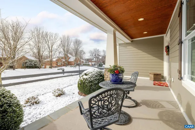 a living room with fireplace furniture and a flat screen tv