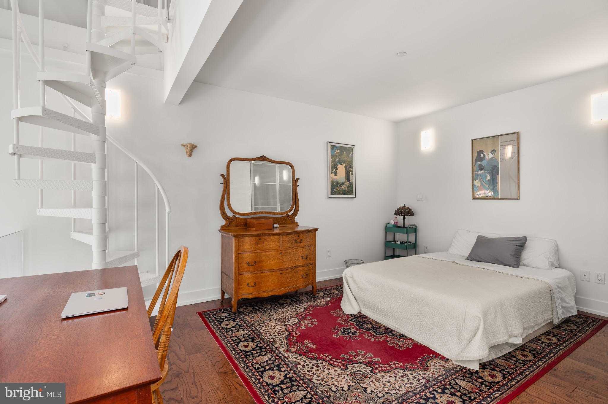 2747 Linden Lane, Unit 203 Silver Spring, MD 20910 - Photo 15 of 34 a bedroom with a bed a couch and dresser