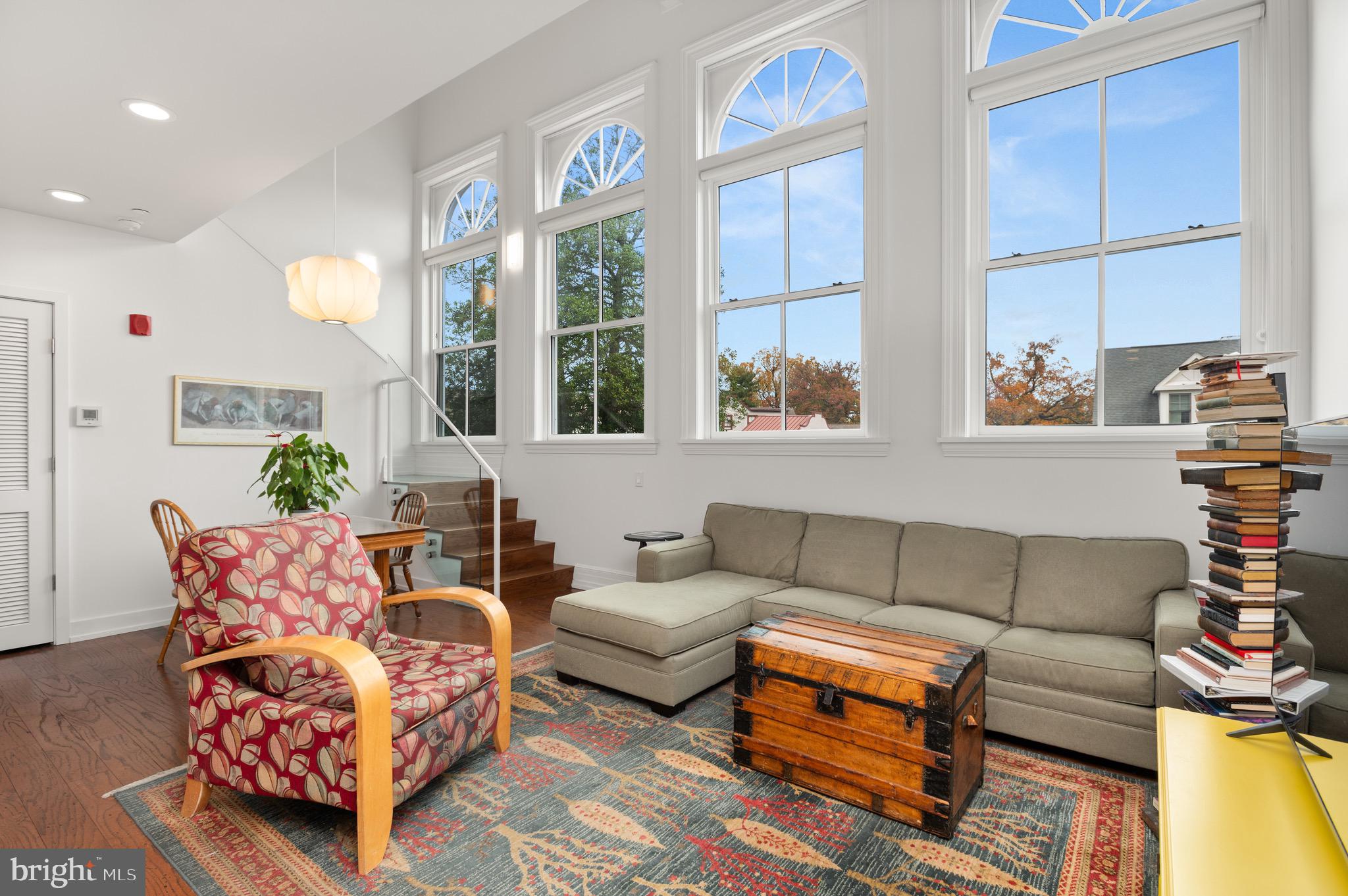 2747 Linden Lane, Unit 203 Silver Spring, MD 20910 - Photo 5 of 34 a living room with furniture and a large window