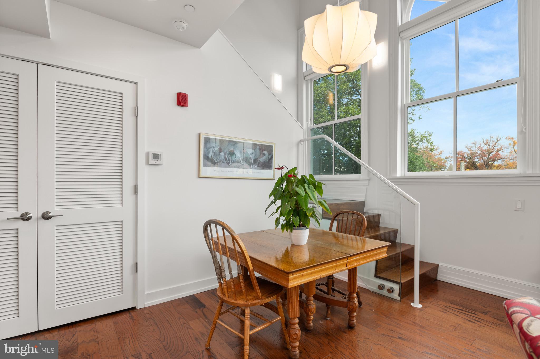 2747 Linden Lane, Unit 203 Silver Spring, MD 20910 - Photo 9 of 34 a view of a dining room with furniture window and wooden floor