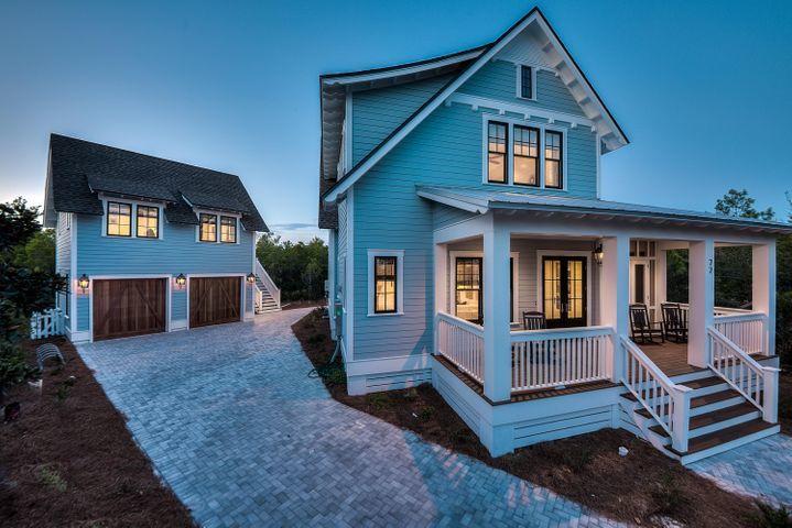77 Shore Bridge Cir Inlet Beach Inlet Beach, FL 32461 - Photo 1 of 20 a front view of a house with a yard