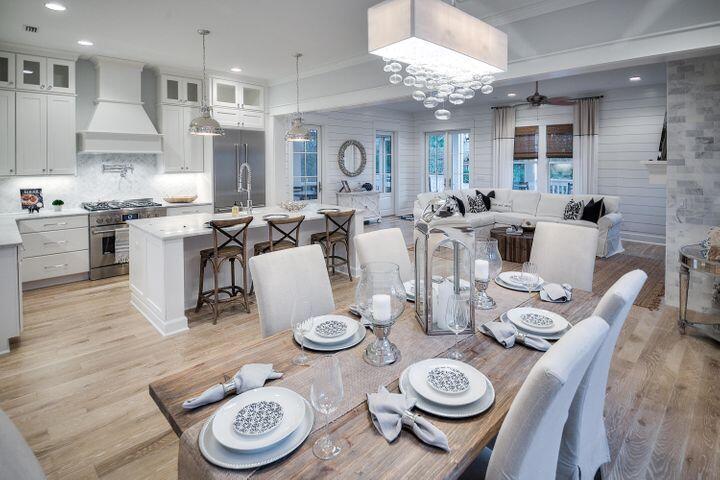 77 Shore Bridge Cir Inlet Beach Inlet Beach, FL 32461 - Photo 2 of 20 a very nice looking dining room with kitchen island furniture a chandelier and kitchen view