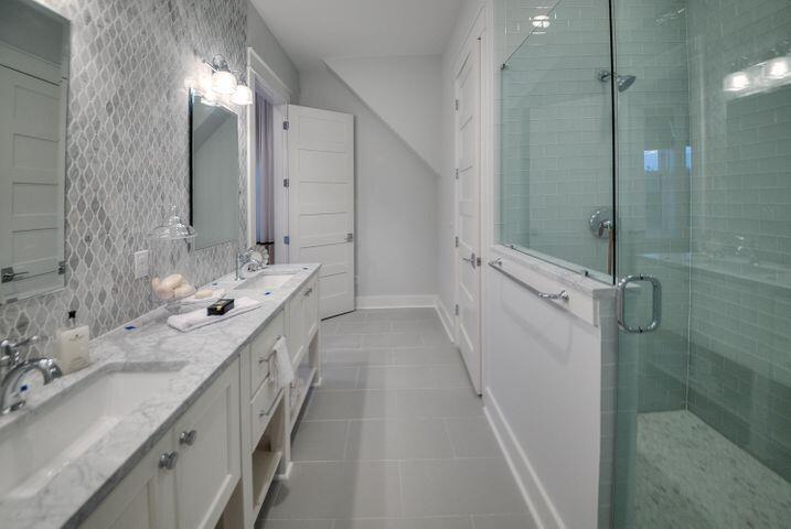 77 Shore Bridge Cir Inlet Beach Inlet Beach, FL 32461 - Photo 12 of 20 a bathroom with a double vanity sink a toilet and shower