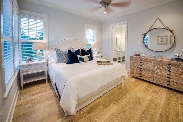77 Shore Bridge Cir Inlet Beach Inlet Beach, FL 32461 - Photo 14 of 20 a bed room with a bed mirror and a window
