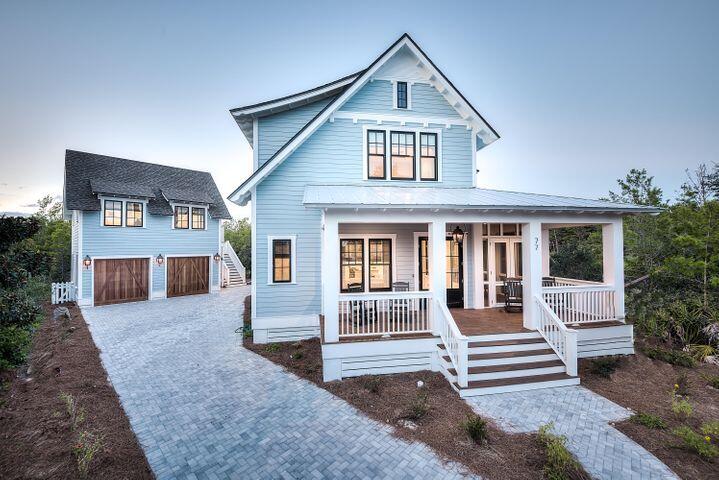 77 Shore Bridge Cir Inlet Beach Inlet Beach, FL 32461 - Photo 16 of 20 a front view of a house with a yard