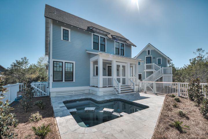 77 Shore Bridge Cir Inlet Beach Inlet Beach, FL 32461 - Photo 17 of 20 a front view of a house with a yard