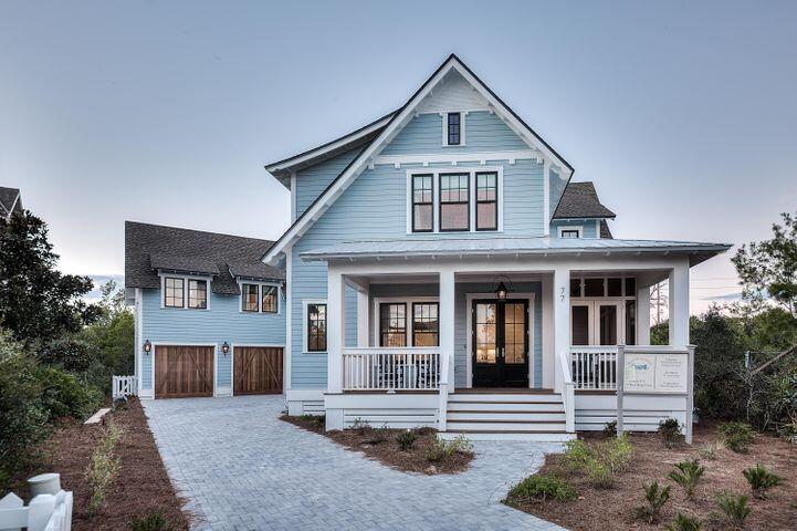 77 Shore Bridge Cir Inlet Beach Inlet Beach, FL 32461 - Photo 18 of 20 a front view of a house with a yard