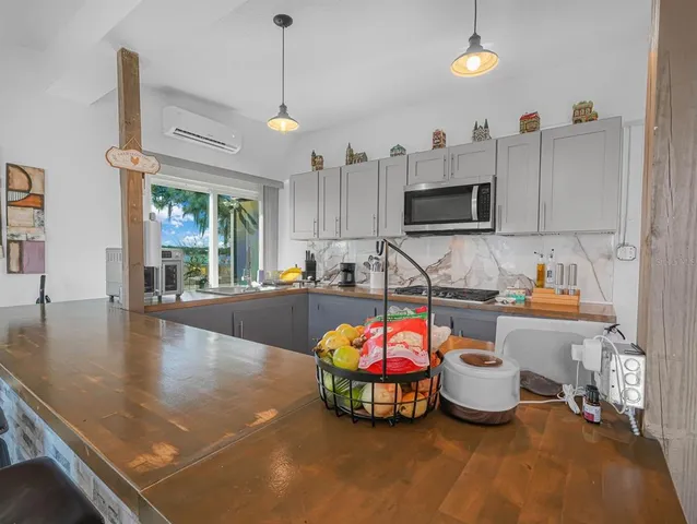 a living room with lots of furniture and a flat screen tv