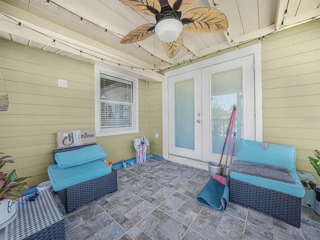 a front view of a house with outdoor seating