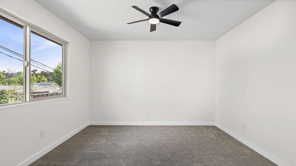134 Espanas Escondido, CA 92026 - Photo 15 of 33 a view of a big room with a window and a ceiling fan