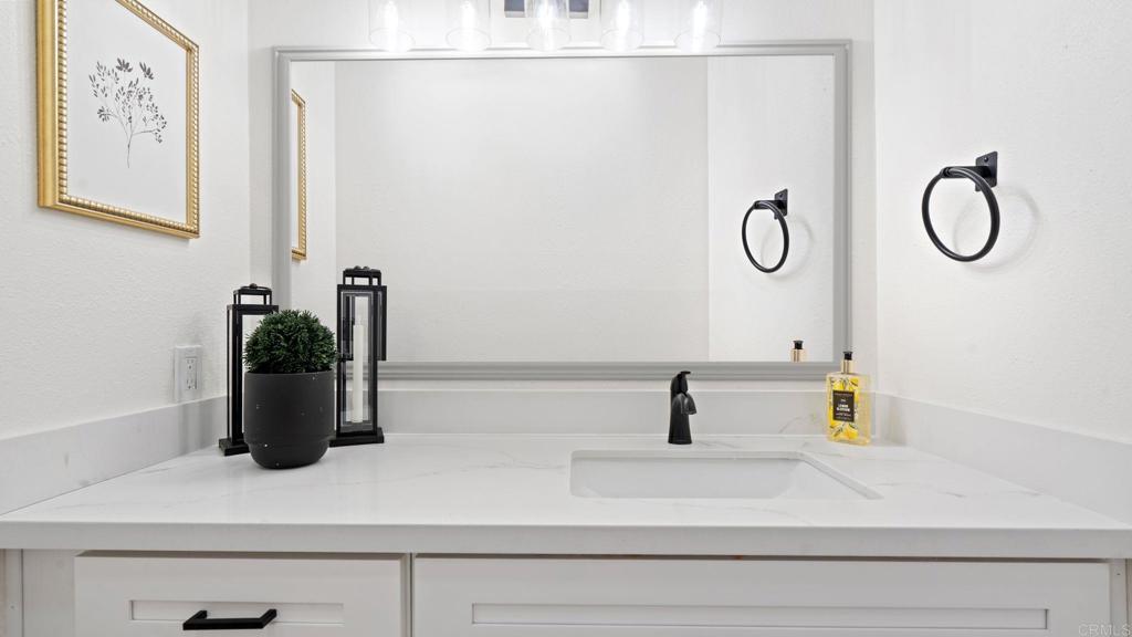 134 Espanas Escondido, CA 92026 - Photo 16 of 33 a bathroom with a sink and a mirror