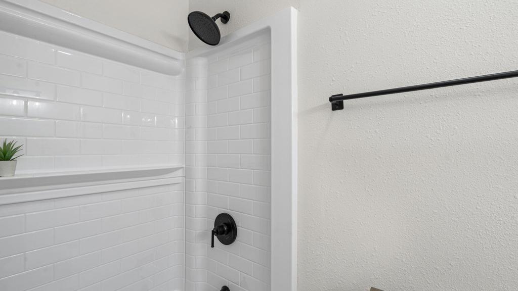 134 Espanas Escondido, CA 92026 - Photo 17 of 33 a bathroom with a shower