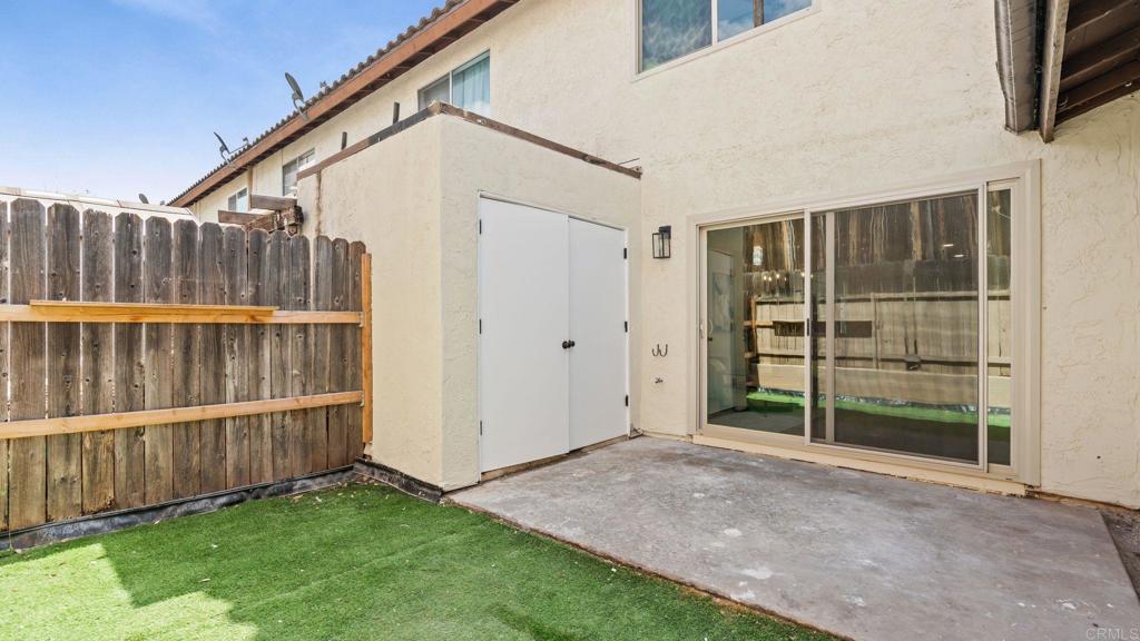 134 Espanas Escondido, CA 92026 - Photo 25 of 33 a view of backyard with wooden fence and a large window
