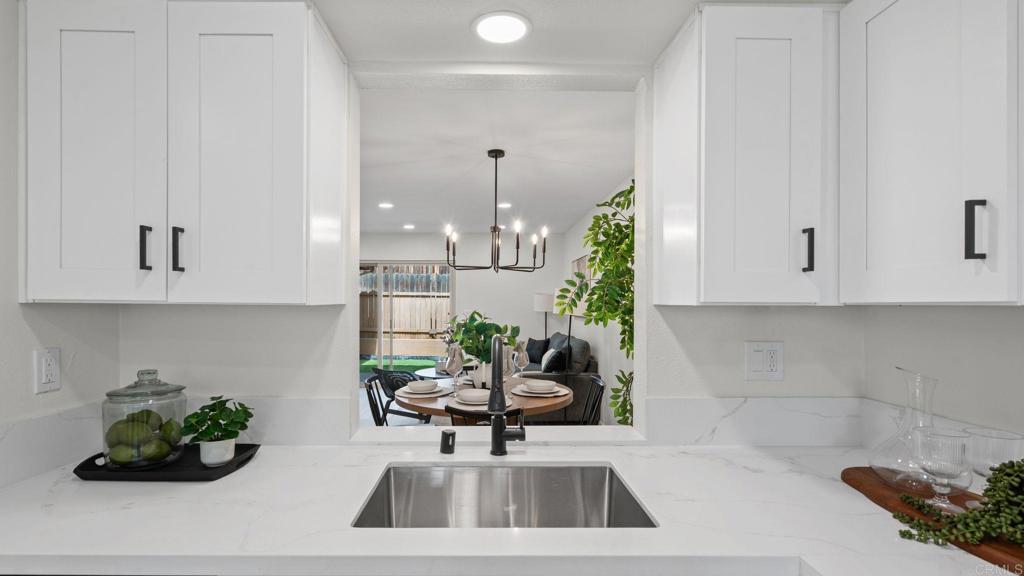 134 Espanas Escondido, CA 92026 - Photo 4 of 33 a kitchen with a white cabinets and a stove