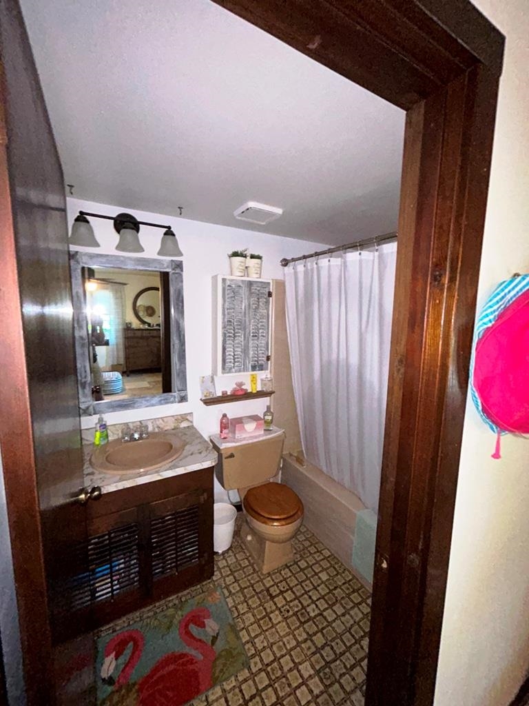 125 Saturn Road St. Augustine, FL 32086 - Photo 23 of 44 a bathroom with a sink a vanity and mirror