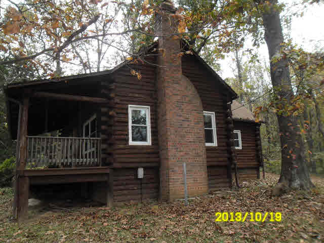 1186 Whippoorwill Road Reva, VA 22735 - Photo 3 of 16 a view of house with a bench in the forest