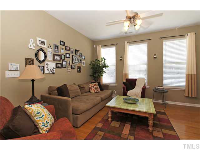 7721 Winners Edge Street Raleigh, NC 27617 - Photo 19 of 20 a living room with furniture and a large window