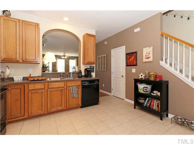 7721 Winners Edge Street Raleigh, NC 27617 - Photo 8 of 20 a kitchen with stainless steel appliances granite countertop a refrigerator and a stove top oven